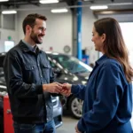 Happy Customer Receiving Car Keys from Mechanic