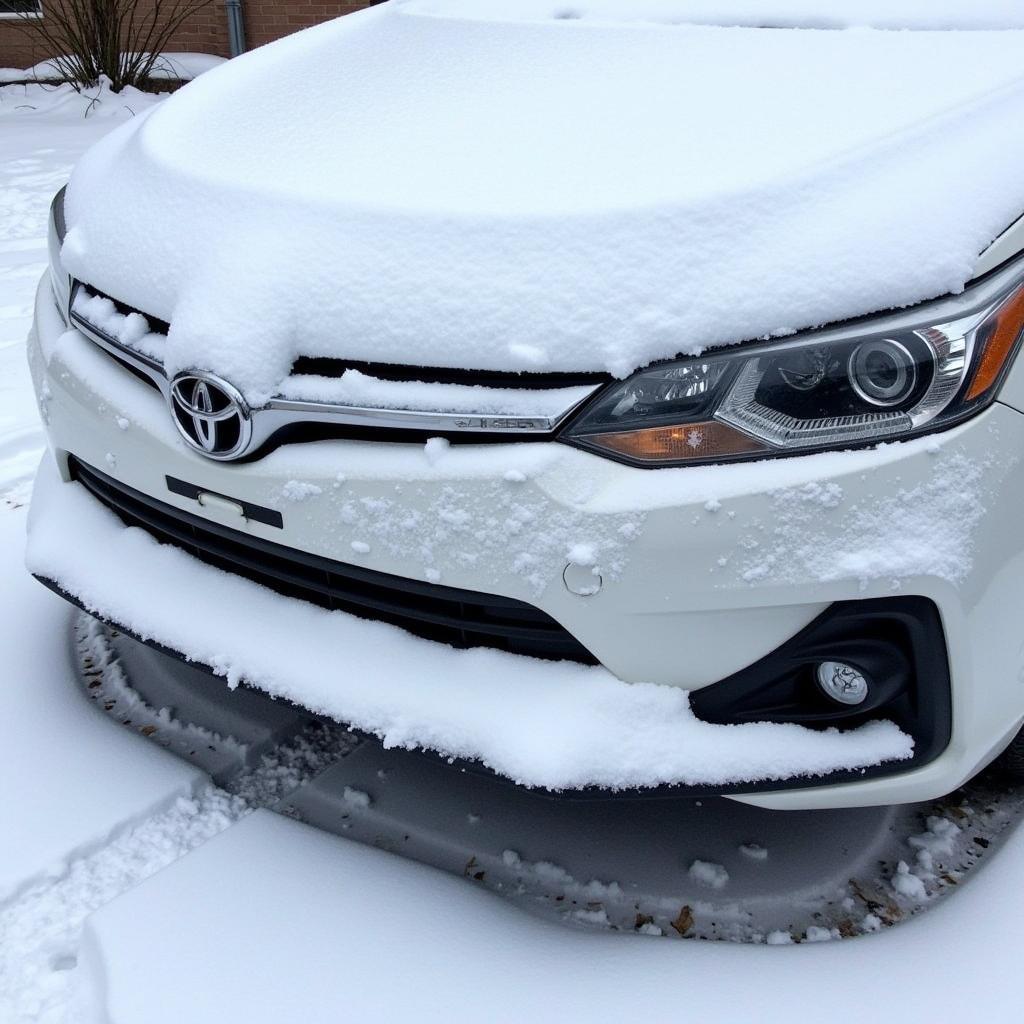 Snow Covered Car with Obstructed AEB Sensor