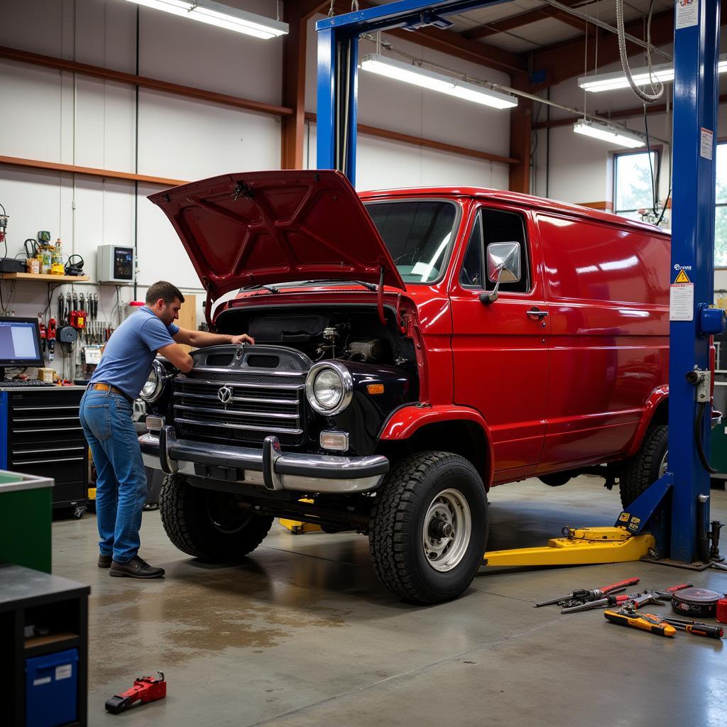 Red Van Undergoing Auto Repair in Duluth