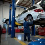 Mechanic working on a car in a Tilton auto repair shop