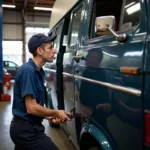 76 Van Auto Service Portland Mechanic Inspecting a Vehicle