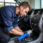 Auto AC Service Technician at Work