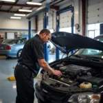 Mechanic working on a car in a Clay PA auto repair shop