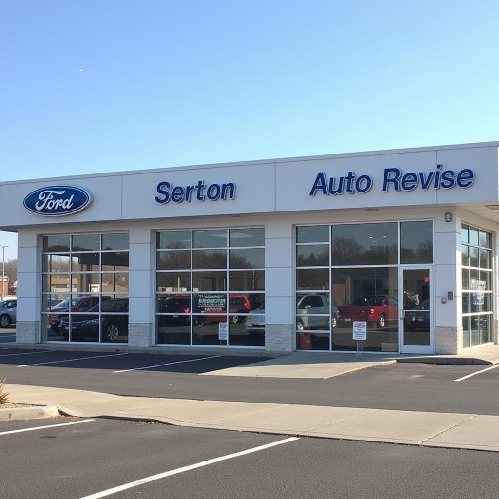 Modern and clean auto revise sales and service center exterior with ample parking and visible signage.