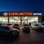 Exterior view of a modern auto dealership in Burlington, showcasing the latest car models and service bays.