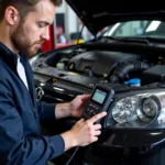 Car Mechanic Performing Diagnostic Check