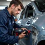 A certified auto repair technician working on a vehicle in El Mirage