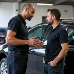 Mechanic explaining the car repair to the customer